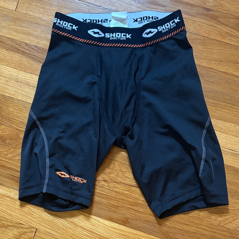 Shock Doctor Boys' Black Compression Shorts with Orange Accents